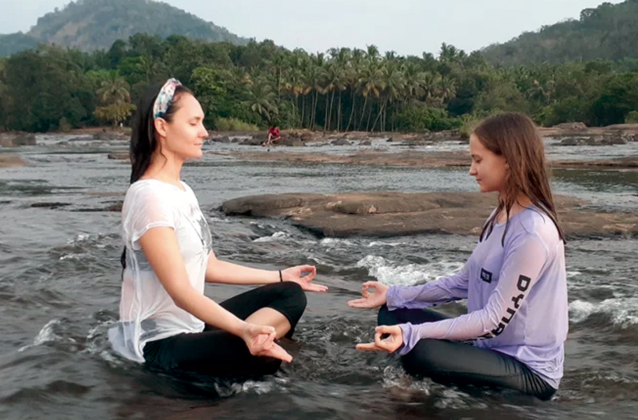 Morning yoga session at an Ayurvedic wellness retreat in Kerala, India